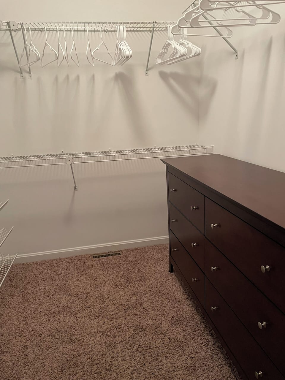 Walk in closet with dresser