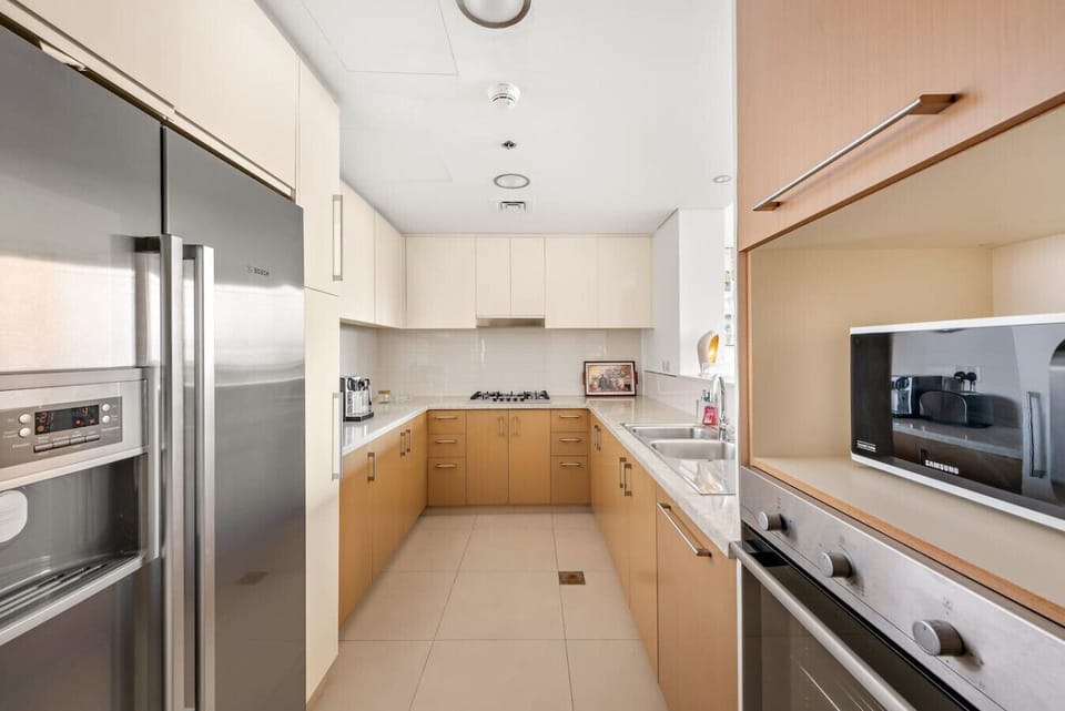 Gourmet Kitchen: Whip up culinary delights in this stylish, sunlit kitchen with modern appliances!