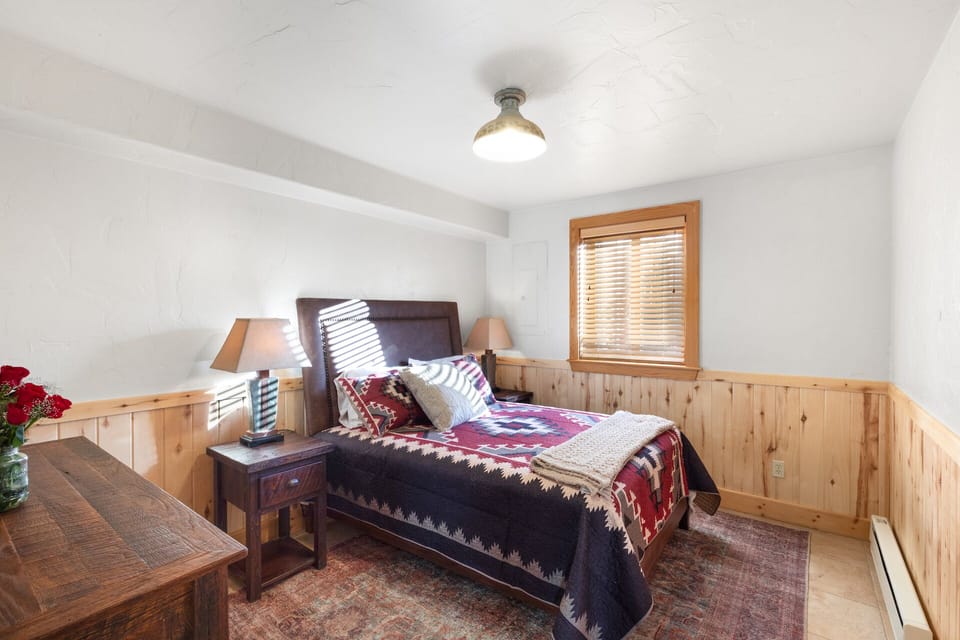 Second bedroom on the main floor with a queen bed.