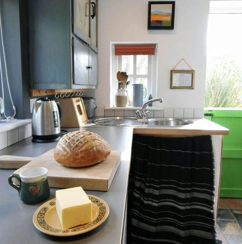 Kitchen and kitchen counter with loaf of bread and butter