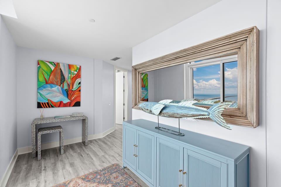 Bright bedroom dresser area with beautiful Gulf views
