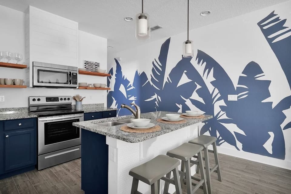 Stainless Steel appliances and a big enough island to seat 3.