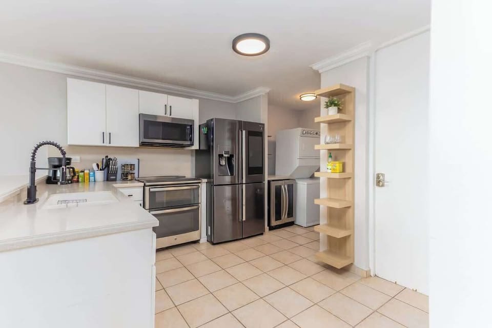 Full kitchen with modern appliances—cook or blend cocktails with ease