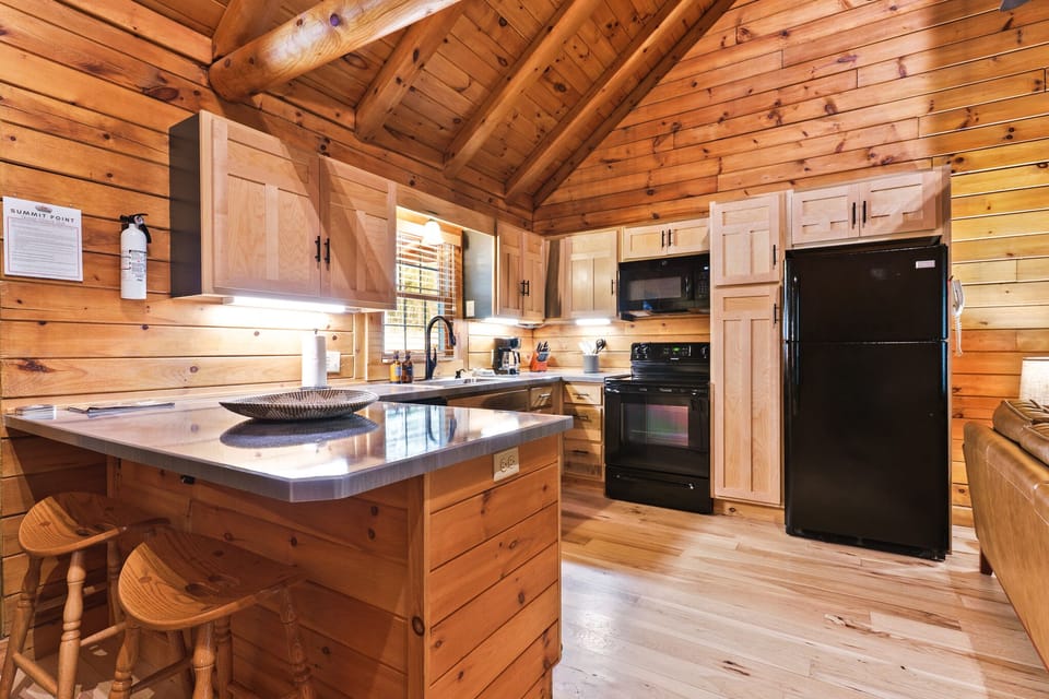 Cozy cabin kitchen stocked with cookware and essentials, blending rustic charm with modern convenience