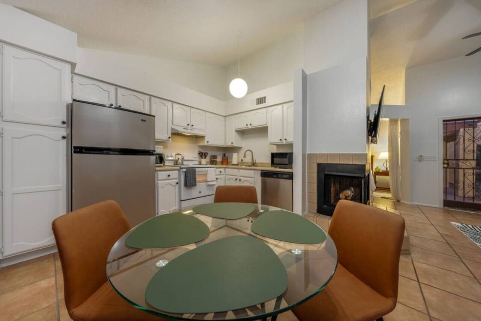 Well-equipped kitchen with dining table, just off the living room