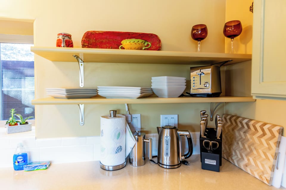 Utensils, plates, and hot water kettle