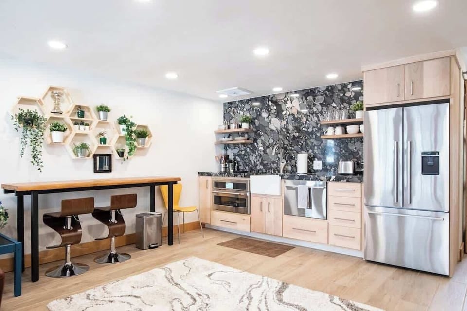 Efficient kitchen has everything.  That is Brazilian river bottom granite and custom Maple.