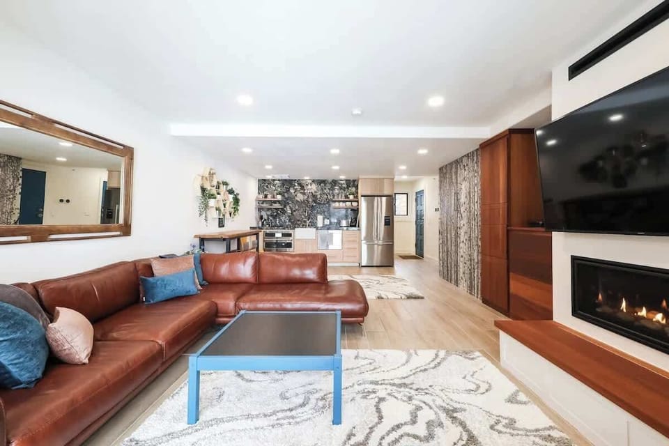 A look back from the sliding glass door to the kitchen on the left and front door on the right. We hope you like the Finnish birch forest wall.