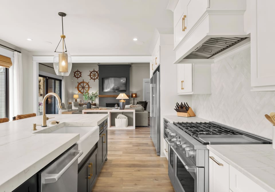 The fully stocked kitchen is a chef's dream with huge large side by side Fridge and freezer, island seating for 4 & wall of windows with lake views. 