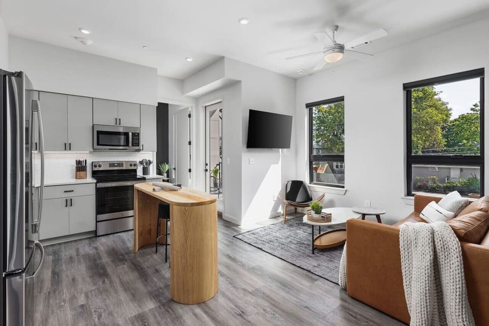 Bright and spacious living room off the kitchen. Smart TV, room darkening shades, and Queen pull-out couch for ultimate comfort.