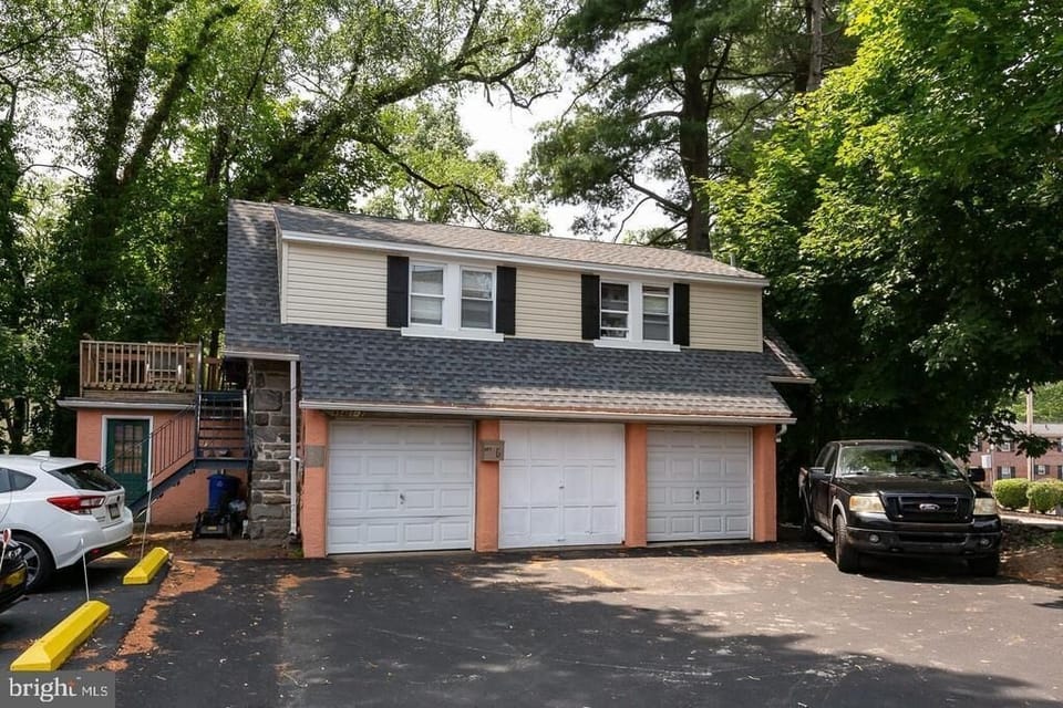Driveway parking and garage space in rear of property.