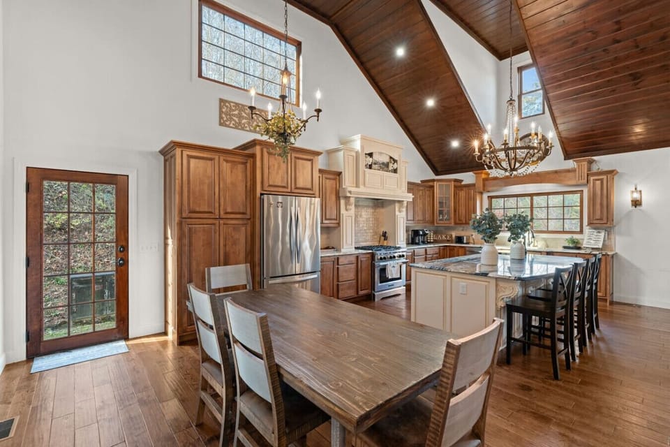 There is a formal dining table that seats 6 guests comfortably as well as additional seating at the countertop bar.