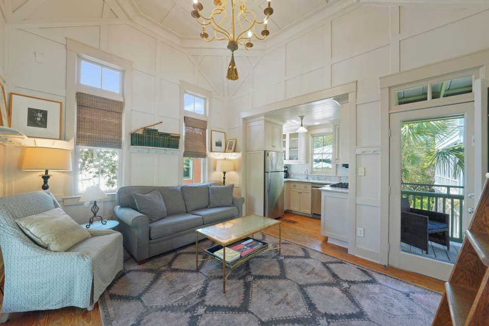 LIVING ROOM VIEW TO KITCHEN & PRIVATE BALCONY