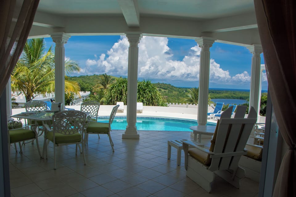 Pool side patio perfect for lounging with amazing sea view.