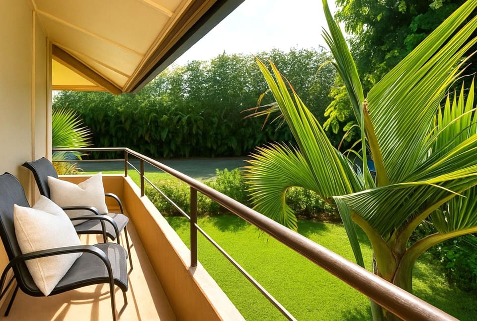 Unwind on this peaceful lanai nestled among lush palms and tropical greenery—your private nook for morning coffee or golden-hour reflection