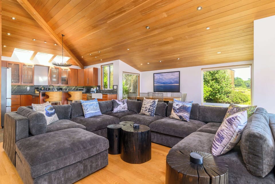 Ocean view living room w/ Smart TV and gas fireplace