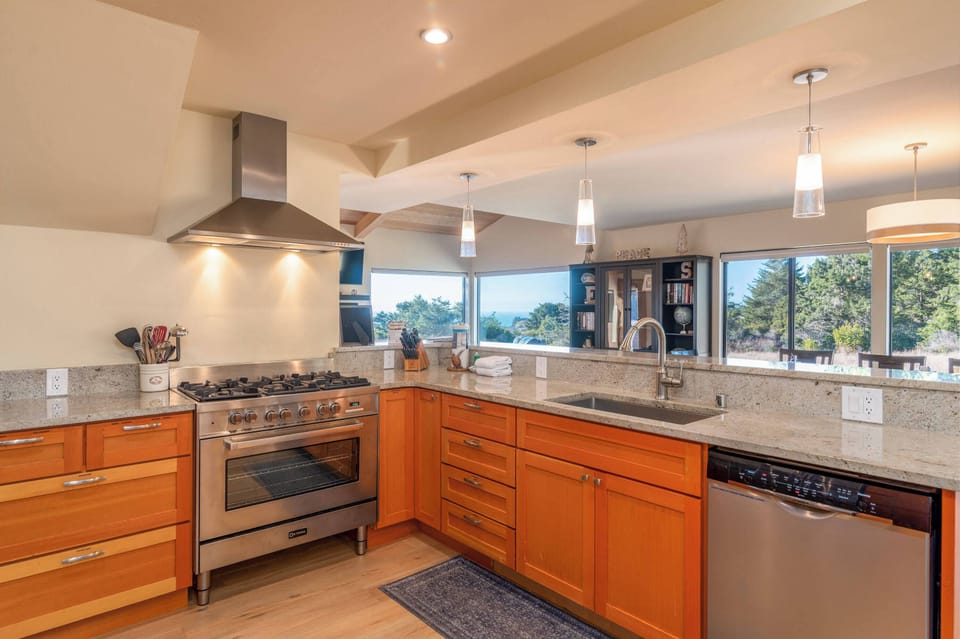 Full kitchen with kettle, coffee maker, toaster oven and more