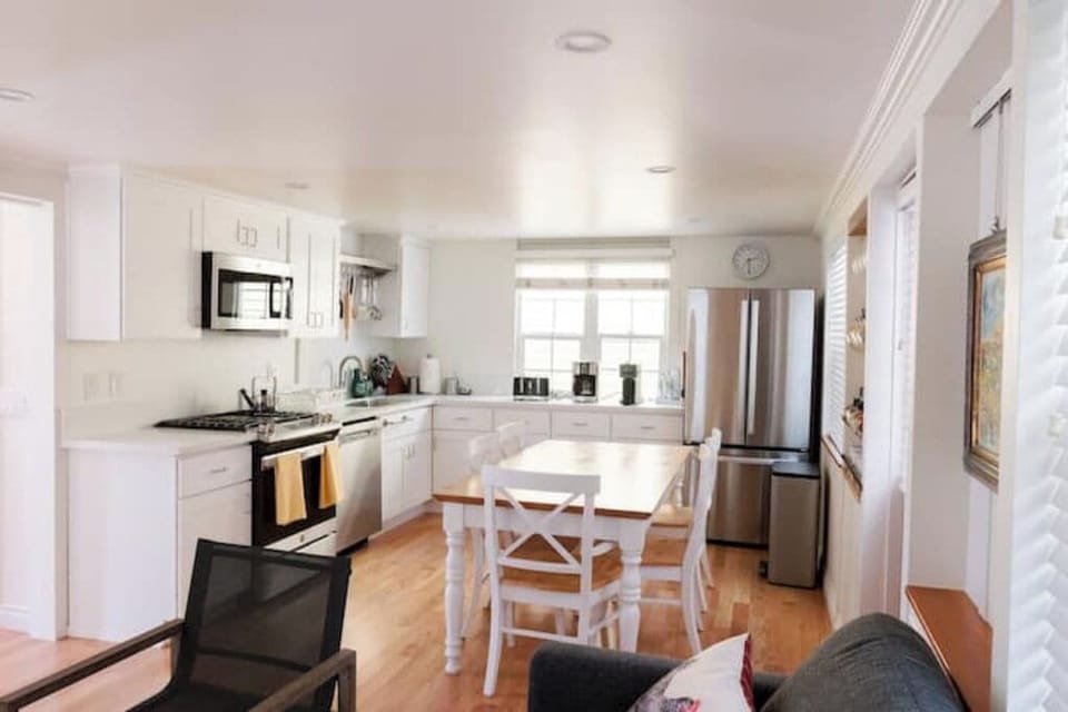 Full kitchen with pots, pans, plates, silverware, etc. 