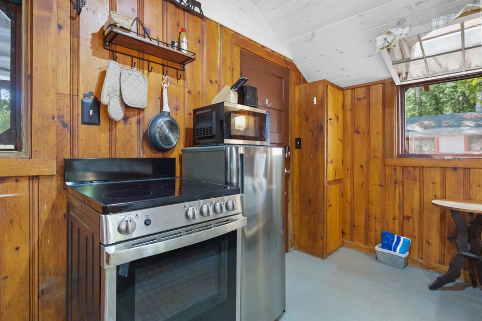 electric cooktop and oven, microwave, kitchen utensils and mini fridge