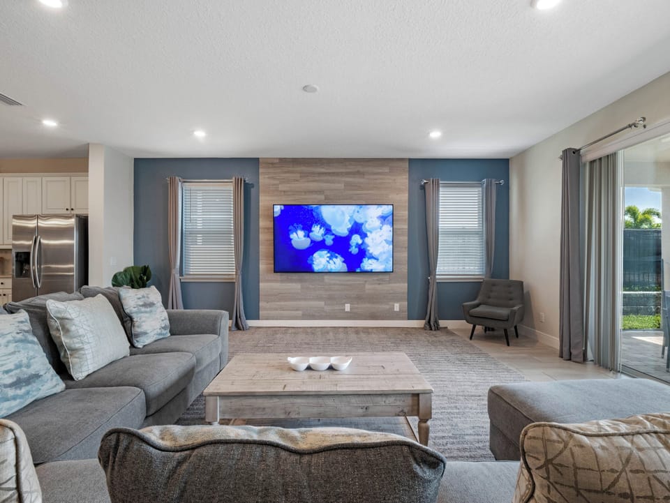 Living area with comfy sectional sofa and flat screen TV