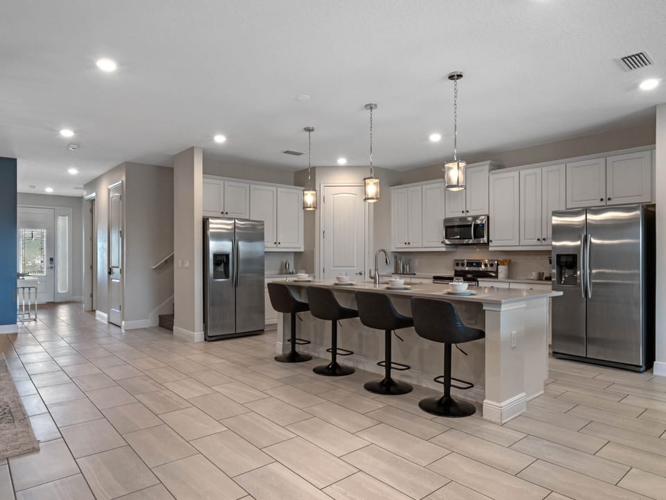 Kitchen area with stainless steel appliances and spacious island
