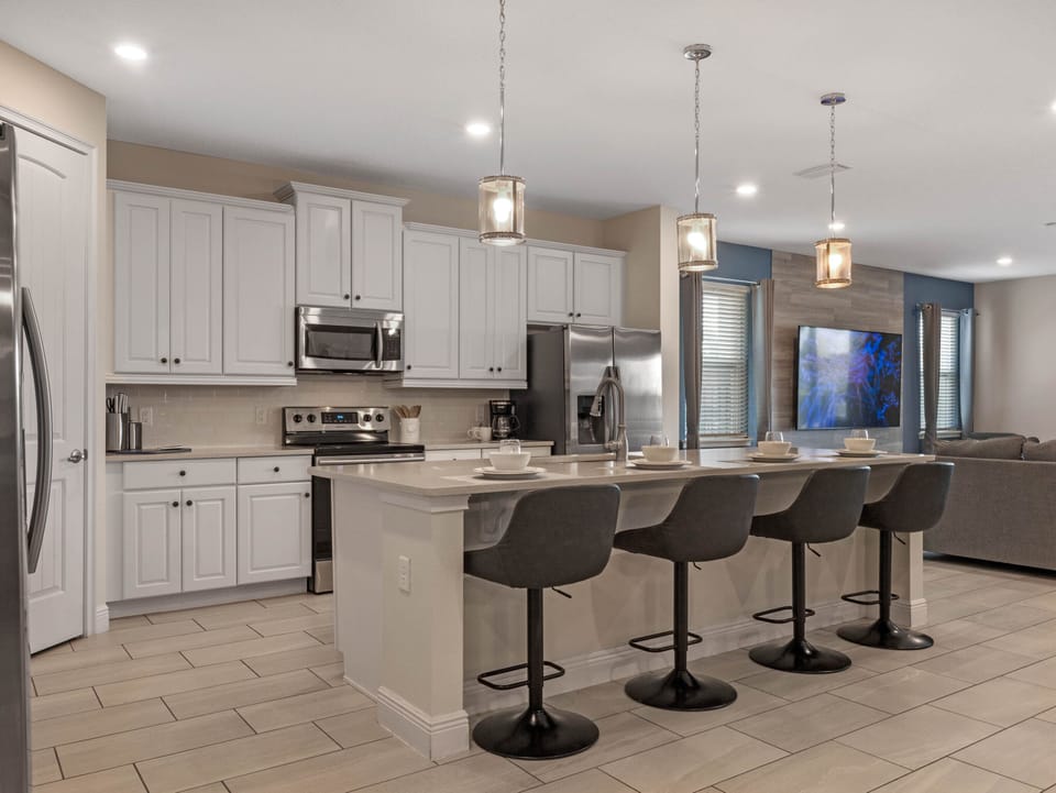 Kitchen area with stainless steel appliances and spacious island