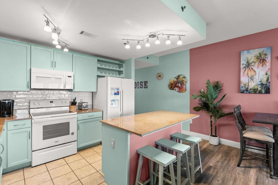 Fully Stocked Kitchen with Island Bar Seating, Lake Views, Keurig Machine and Drip Coffee Maker