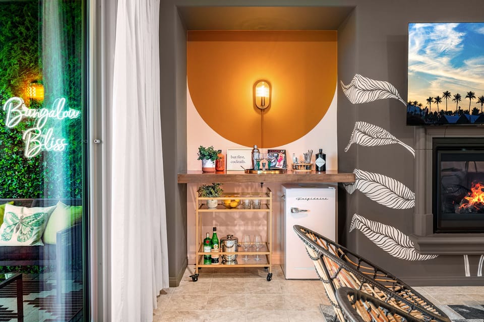 Make yourself a cocktail at the bar and enjoy it outside on nearby patio