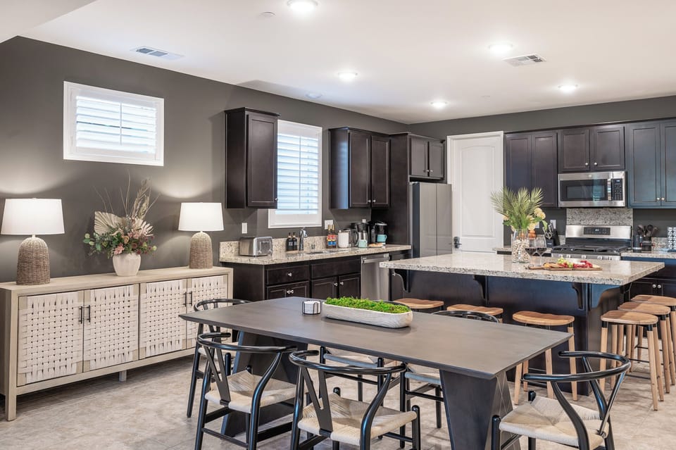 Dining area and fully equipped kitchen w/ coffee station and high-end appliances