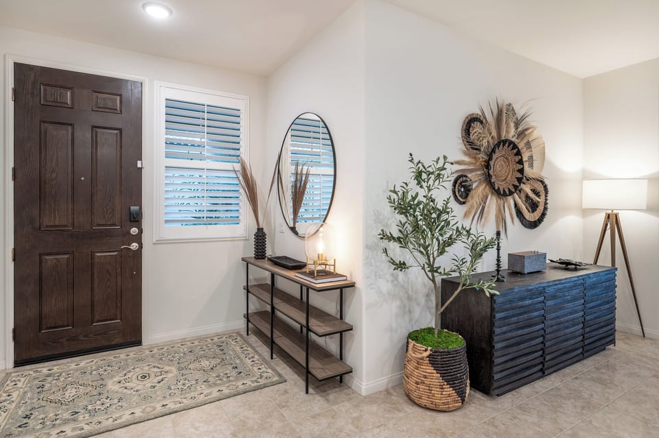 Entry way with mirror and basket weave decor, Klipsch bluetooth speaker