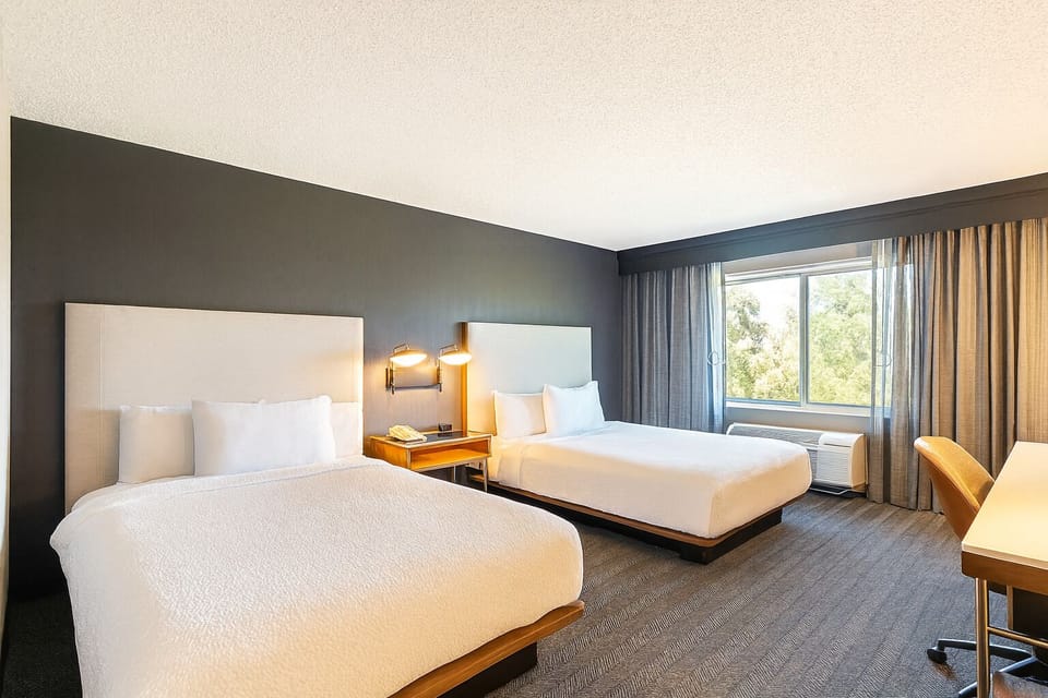 Stretch out on two plush beds after a full day.