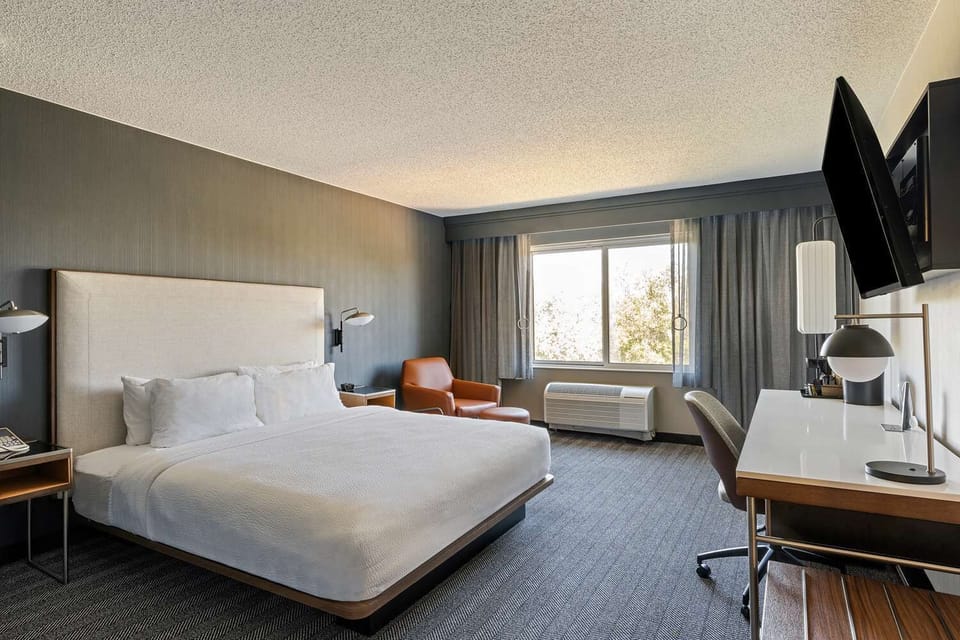 Relax in a spacious king room with dedicated workspace.