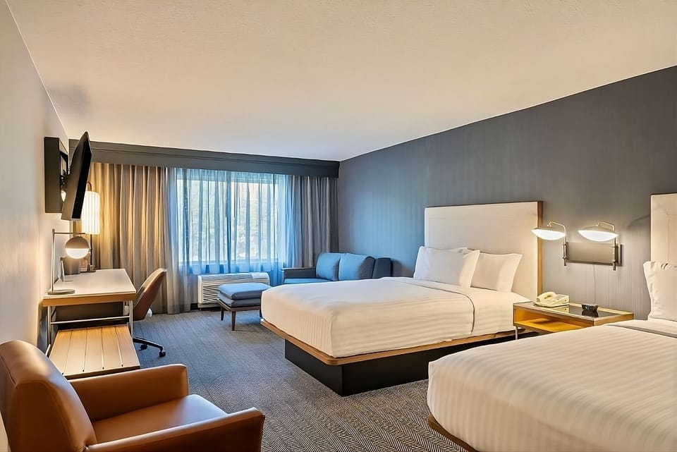 Unwind in a spacious room with two plush beds.