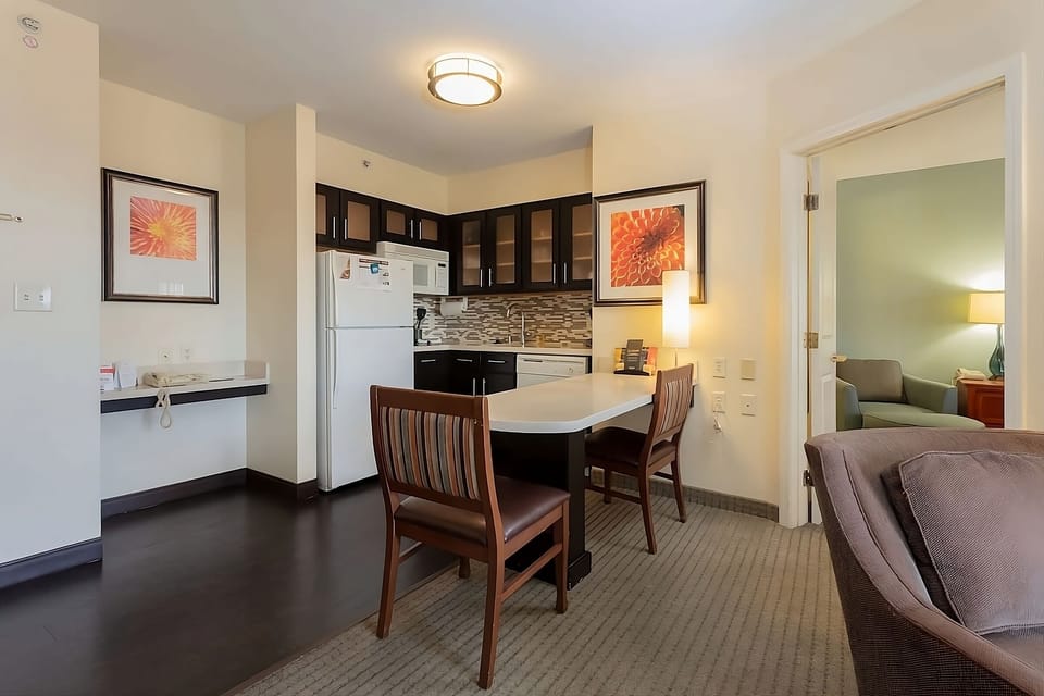 Gather for easy meals at the bright kitchenette dining bar.