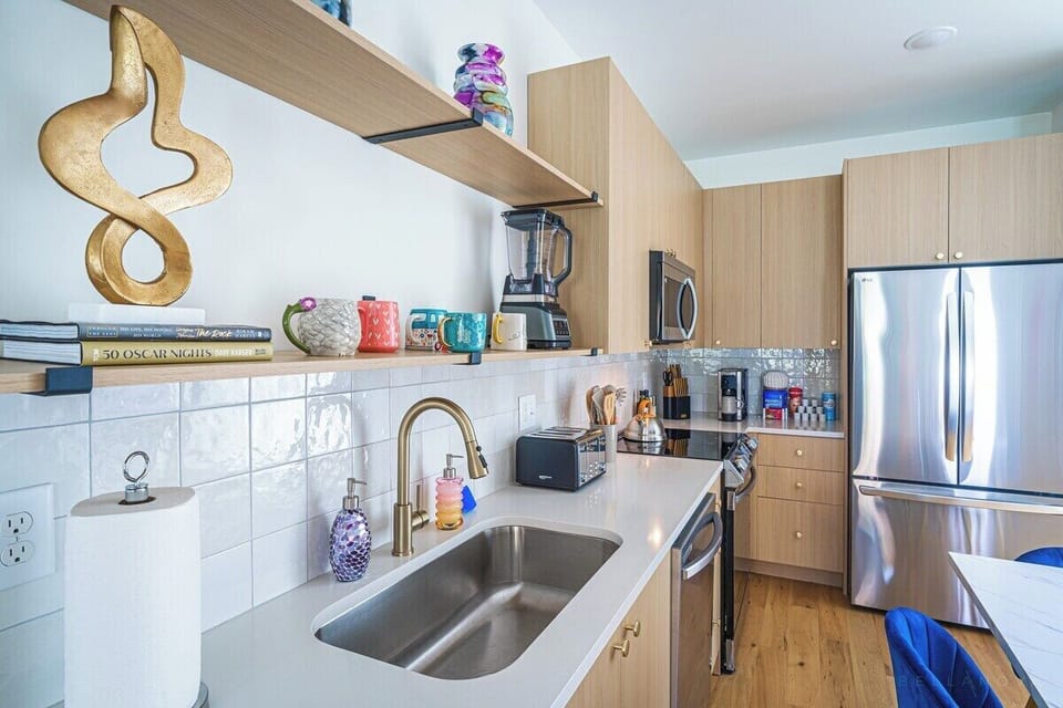 Indulge your foodie fantasies in our sleek, fully-stocked gourmet chef's kitchen.