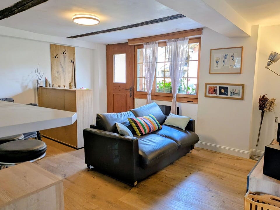 Furniture, Interior Design, Flooring, Floor, Wall, Couch, Wood, Ceiling, Table, Room