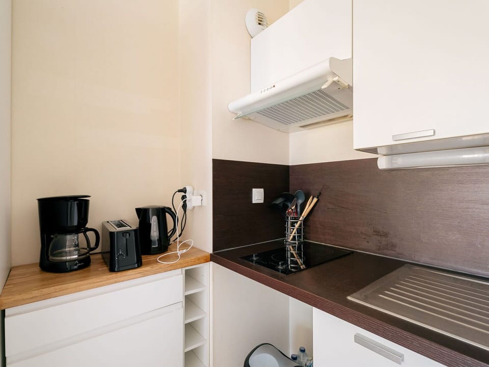 Cabinetry, Countertop, Kitchen Appliance, Wood, Interior Design, Flooring, Floor, Kitchen, Wall, Home Appliance