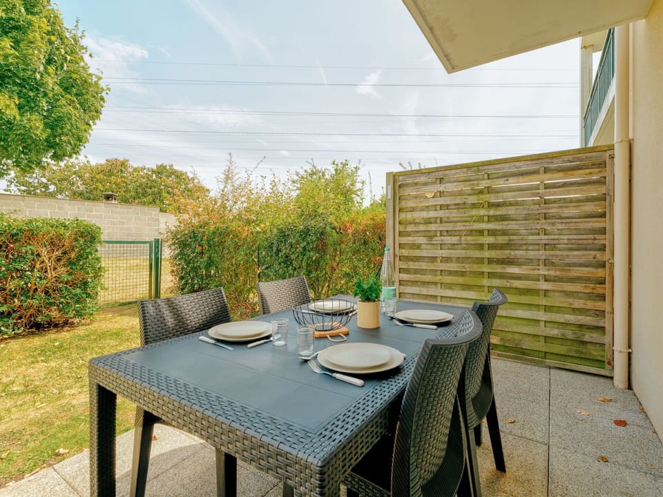 Furniture, Plant, Table, Sky, Property, Chair, Outdoor Table, Cloud, Outdoor Furniture, Building