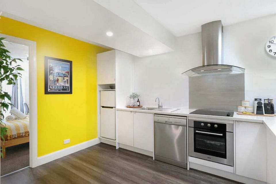 Modern kitchen with vibrant accents and sleek finishes