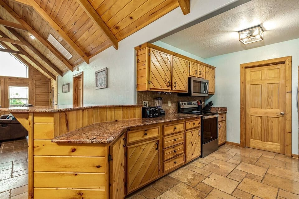 fully stocked kitchen, crock pot, blender, toaster, waffle iron, coffee, bakeware