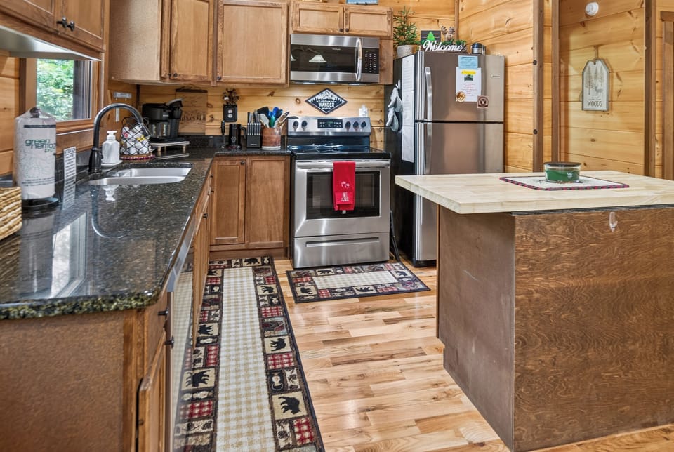Rustic kitchen with modern appliances and ample counter space for cooking.