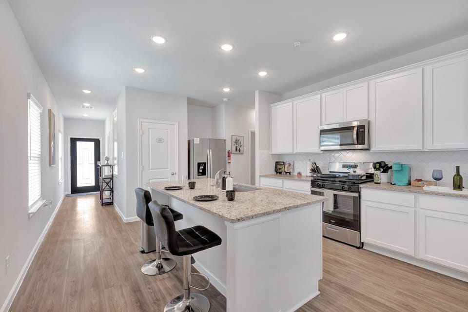 Enjoy the bar stools at our kitchen island!  Comfortably seats 8.