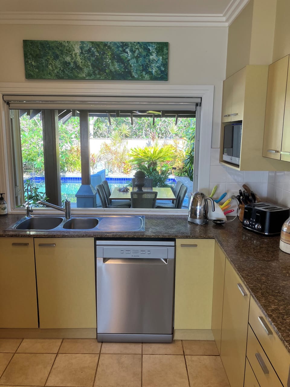 Fully equipped kitchen looking out to the pool