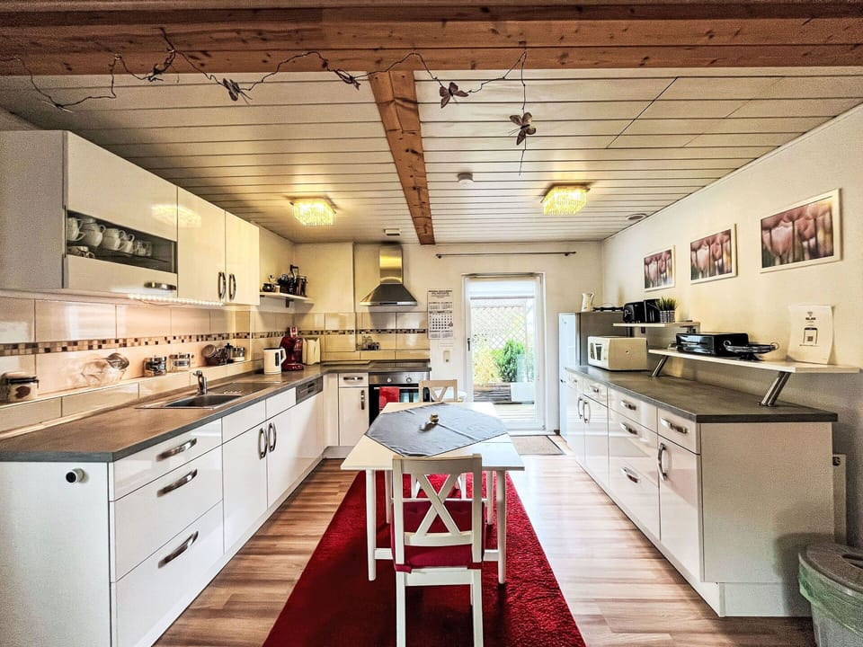 Cabinetry, Countertop, Furniture, Kitchen, Wood, Interior Design, Architecture, Drawer, Flooring, Floor