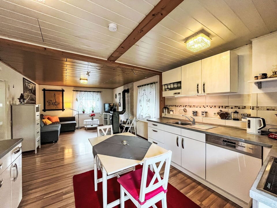 Property, Cabinetry, Countertop, Table, Chair, Wood, Lighting, Interior Design, Kitchen, Drawer