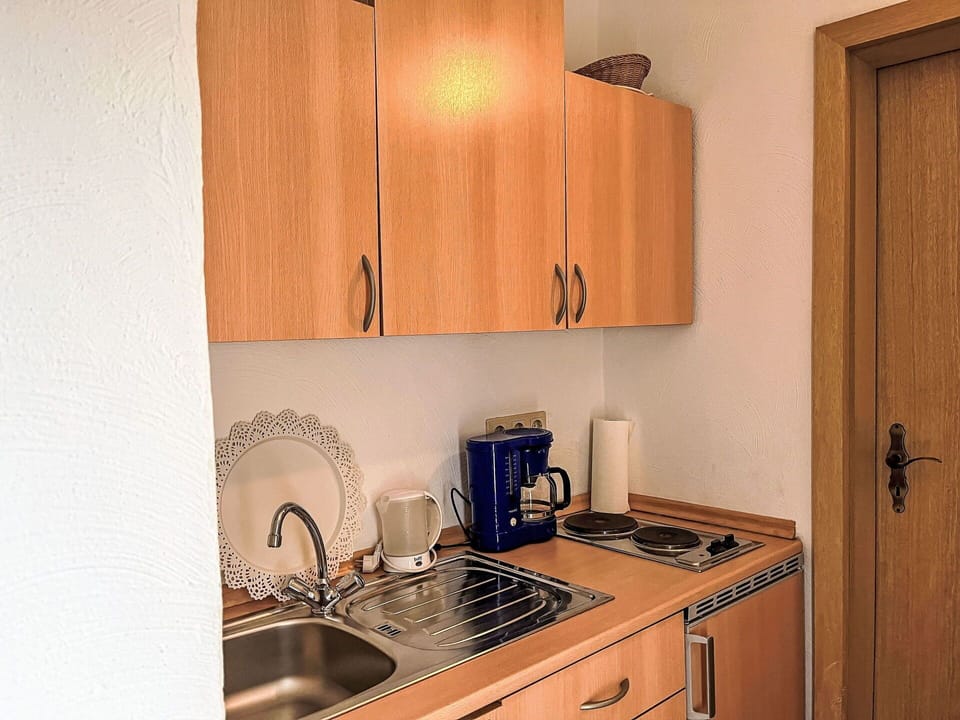 Cabinetry, Sink, Kitchen Sink, Property, Furniture, Countertop, Kitchen Appliance, Wood, Kitchen Stove, Interior Design