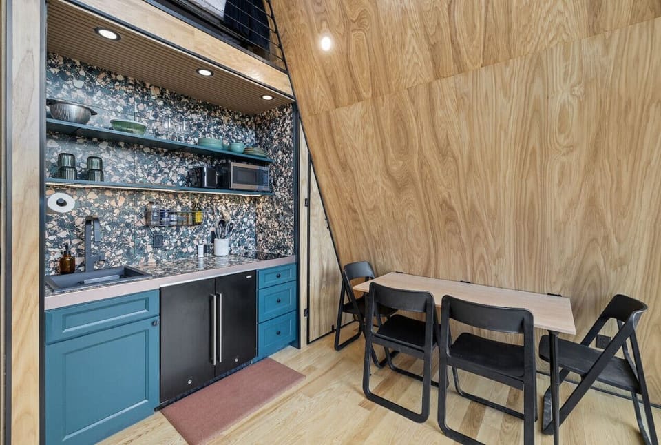 The kitchen is equipped with all the basics you need for preparing simple meals, and the adjacent dining area offers a comfortable space to enjoy your food.