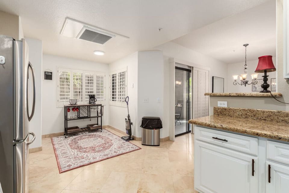 Large kitchen with stainless steel appliances.