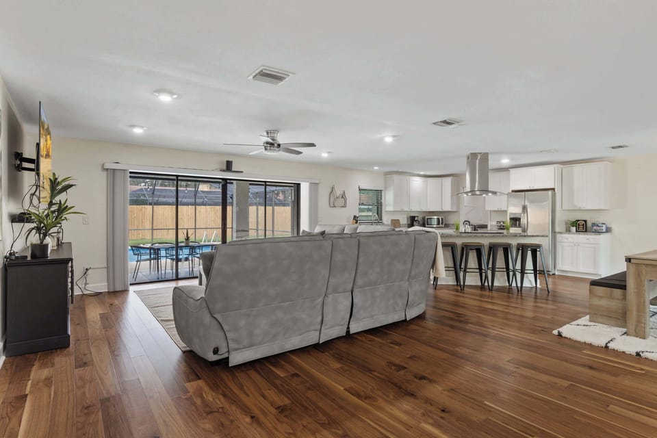 Enjoy seamless indoor-outdoor living with this spacious open floor plan that extends to the poolside, creating the perfect atmosphere for relaxation and entertainment.