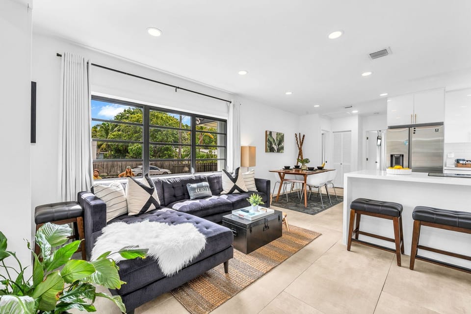 Open concept floorplan with minimalist furnishings, inspired artwork, and lush plants create a calming ambiance, making it an ideal space to reconnect, retreat, and reset.